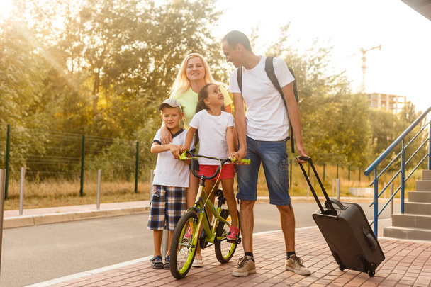 Happy cheerful young family with kids ready for vacation   - Photo, Image