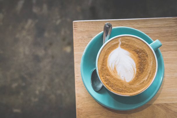 a cup of coffee latte with milk foam in porcelain cup - Foto, Imagen