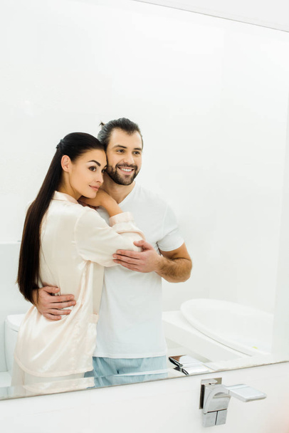 romantic young couple embracing at morning in bathroom - Photo, Image