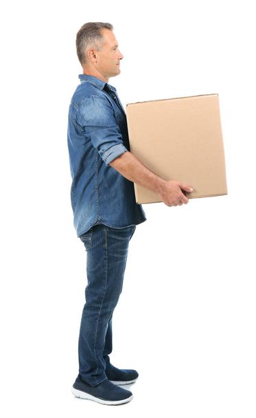 Full length portrait of mature man carrying carton box on white background. Posture concept - Фото, зображення