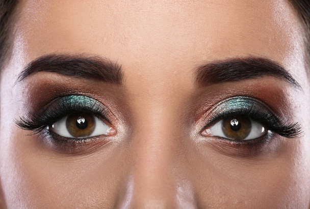 Young woman with eyelash extensions and beautiful makeup, closeup view - Photo, image