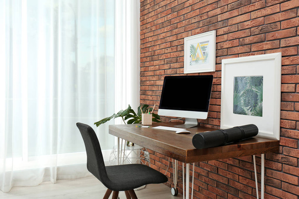 Interior of stylish workplace with modern computer at home - Foto, afbeelding