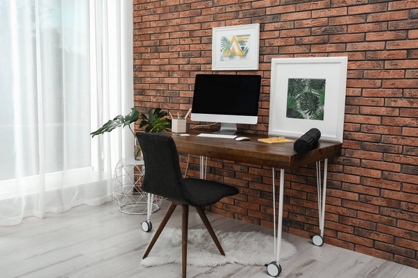 Interior of stylish workplace with modern computer at home - Фото, зображення