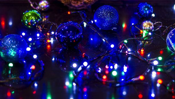 Christmas background, garland lights, holiday toys in blue - Foto, afbeelding