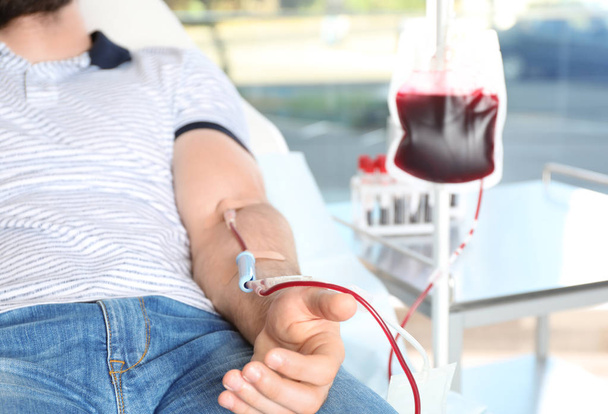 Man making blood donation at hospital, closeup - Fotografie, Obrázek