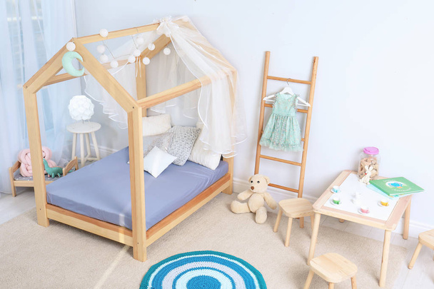 View of cozy child's room interior with cute bed - Φωτογραφία, εικόνα