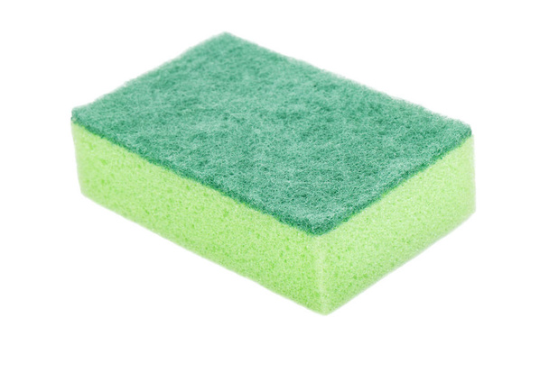 白い背景の上の緑の食器洗いスポンジ - 写真・画像