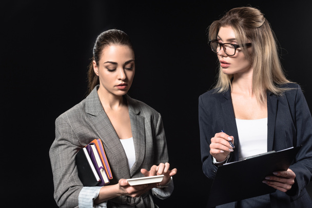 confident young businesswomen isolated on black - Photo, Image
