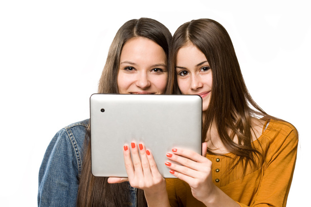 Teenagers having fun with a tablet computer. - Photo, Image