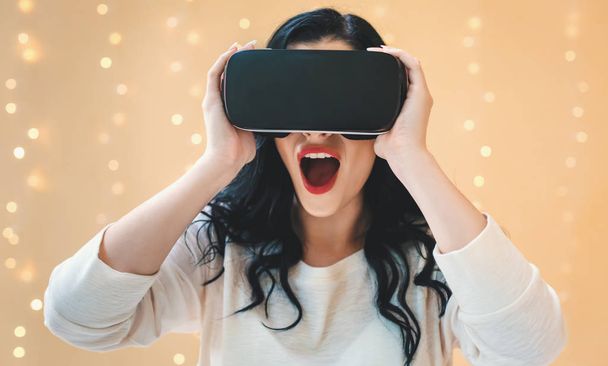 Young woman using a virtual reality headset - Foto, Bild