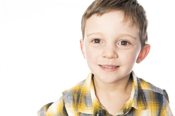 A boy shot in the studio on a white background. - Photo, image