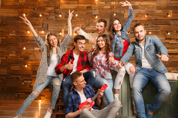 Group of  friends happy people, students  smiling, talking,  laughing, having fun at home party. Positive girls and boys Friendship between men and women. - 写真・画像