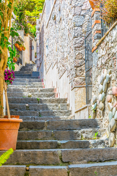 View of a steep path connecting Isola Bella and Taormina, Sicily, Ital - Foto, immagini