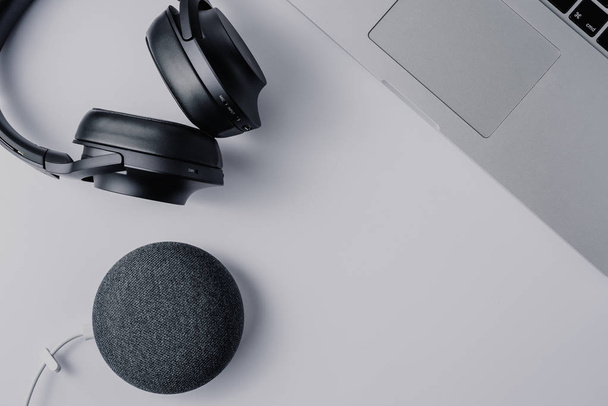 modern technologies headphones laptop and smart speaker over white background - Fotoğraf, Görsel