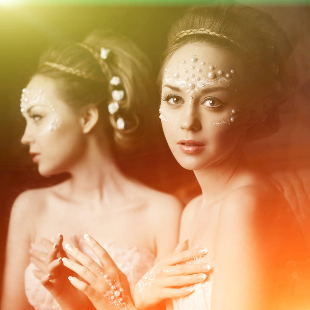 Stylish woman with creative make-up of pearls - Фото, зображення