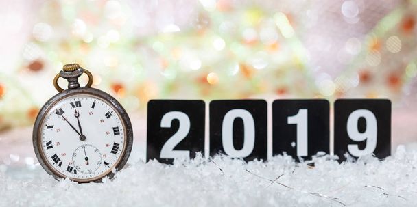 2019 New Years eve celebration. Minutes to midnight on an old watch, bokeh festive background, banner - Фото, зображення