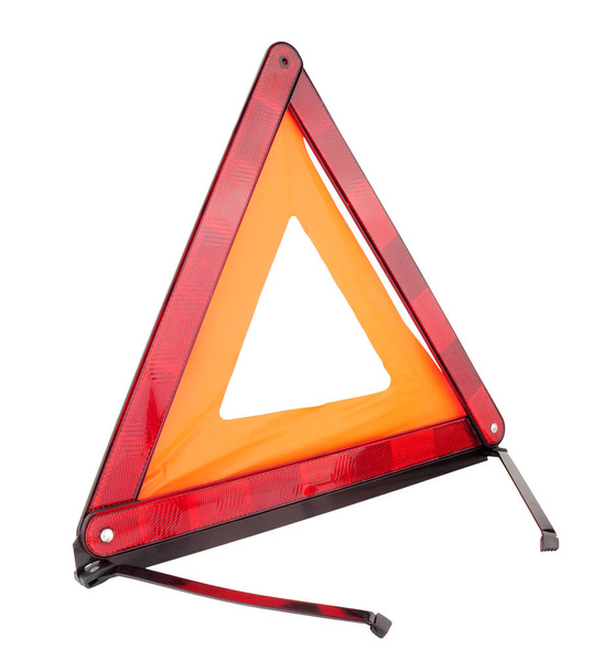 Emergency reflective car warning triangle used to warn others of a broken down vehicle, a legal requirement in most European countries, isolated on a white background - Photo, Image