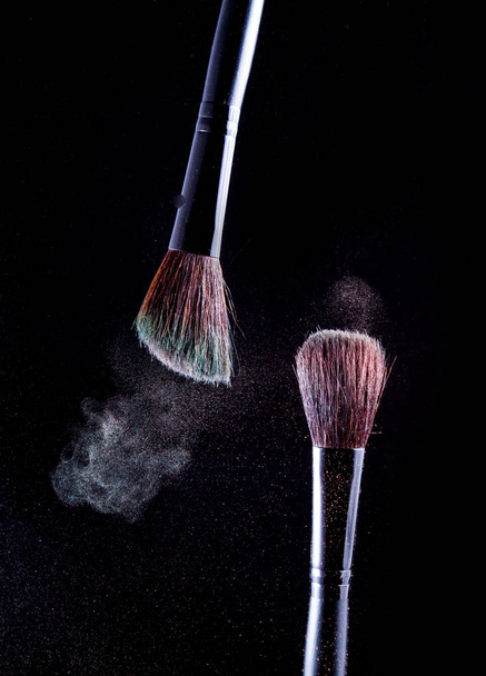 Makeup brush on black background - Foto, Imagen
