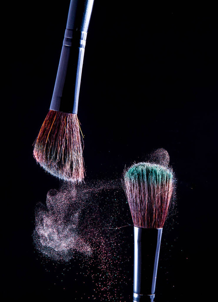 Makeup brush on black background - Foto, imagen