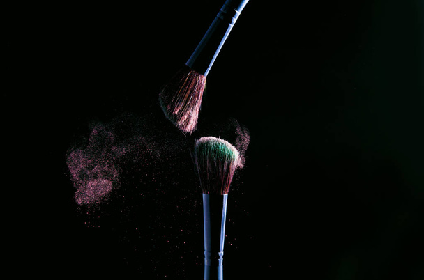 Makeup brush on black background - Фото, зображення