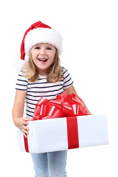 Little girl holding gift box on white background - Фото, изображение