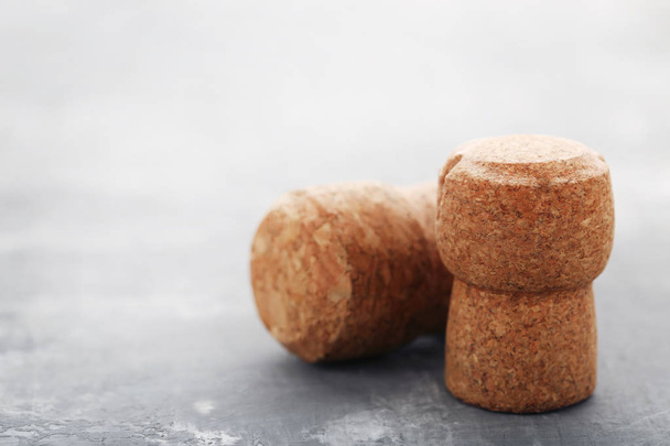 Champagne corks on grey wooden table - Φωτογραφία, εικόνα