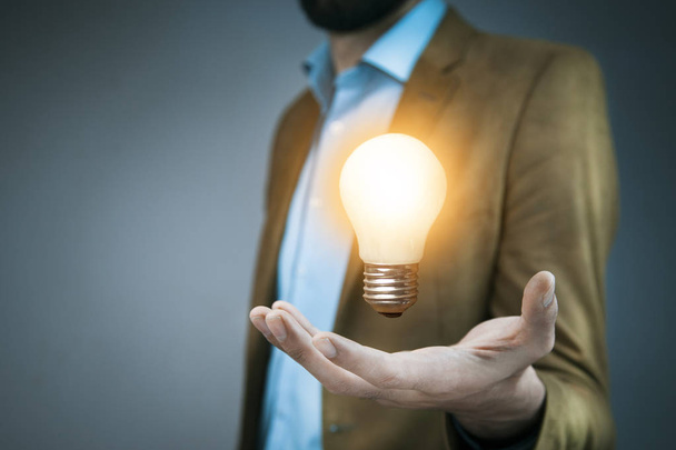 idea concept. Hand of business man  light bulb - Photo, Image