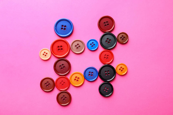 Hashtag sign made of buttons on color background - 写真・画像