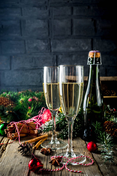 Two glasses of champagne with Christmas decoration on wooden background, Happy New Year and Xmas Celebration. Copy space - Foto, Imagem