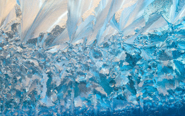 New Year and Christmas abstract icy snowy background with real ice crystals macro in cold blue tones - Foto, imagen