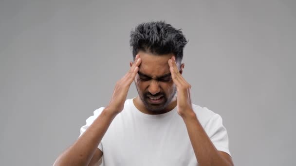 unhappy indian man suffering from headache - 映像、動画