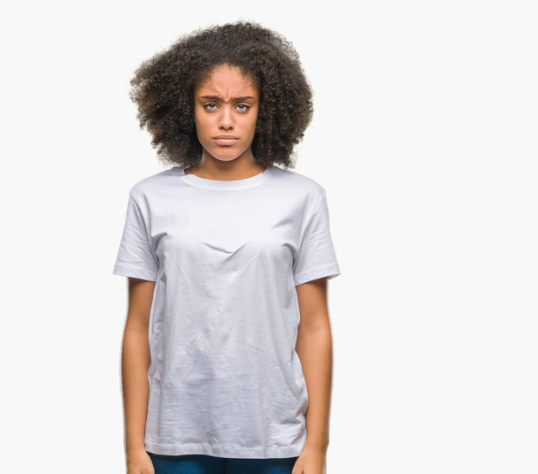 Young afro american woman over isolated background depressed and worry for distress, crying angry and afraid. Sad expression. - Photo, Image