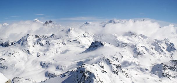 Panoramic view on Alps winter mountains - 写真・画像