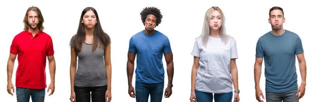 Composition of african american, hispanic and caucasian group of people over isolated white background puffing cheeks with funny face. Mouth inflated with air, crazy expression. - Photo, Image