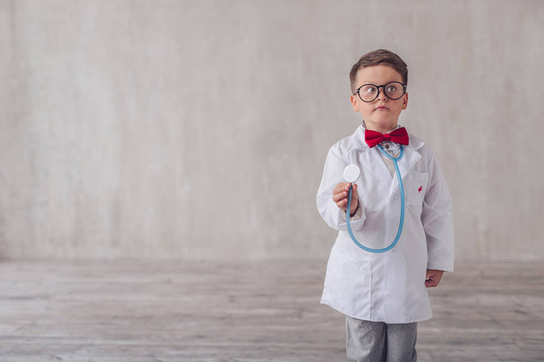 Little child with a stethoscope in studio - Photo, Image