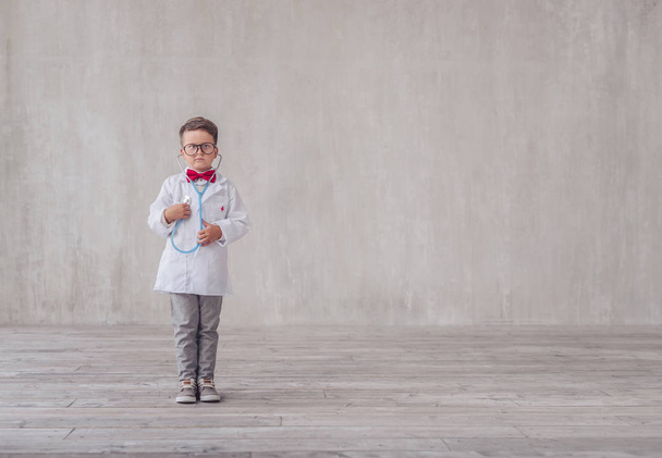 Little boy with a stethoscope indoors - Foto, Imagen