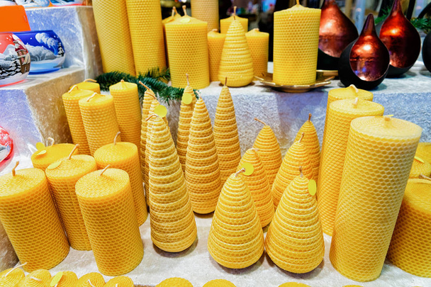 Wax candles in Christmas Market at Gendarmenmarkt in Winter Berlin, Germany. Advent Fair Decoration and Stalls with Crafts Items, on the Bazaar. - Photo, Image