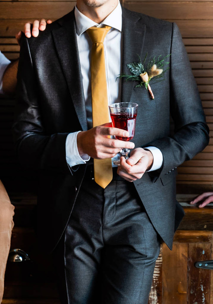 elegant groom indoor with drink - Zdjęcie, obraz