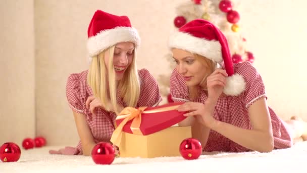 Girl friends with gift emotions. New yearn presents and preparation gift. Merry christmas and Happy new year. Best friends and funny girls celebrate New Year. - Felvétel, videó