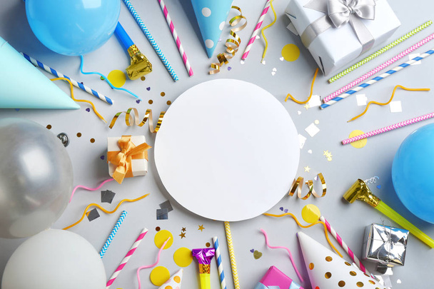 Flat lay composition with party accessories and space for text on grey background - Photo, image