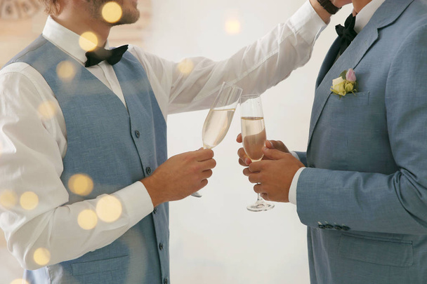 Newlywed gay couple with glasses of champagne at home, closeup - Fotoğraf, Görsel