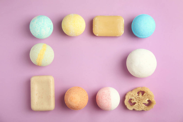 Flat lay composition with bath bombs, soap bars and space for text on color background - Foto, Bild