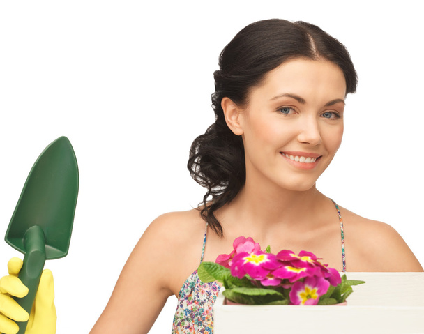 Housewife with flower in box and gardening trowel - Fotografie, Obrázek
