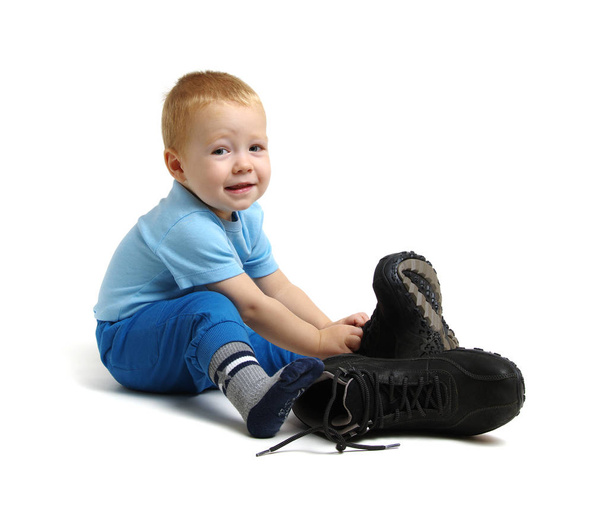 Little boy in father's shoes - Photo, Image