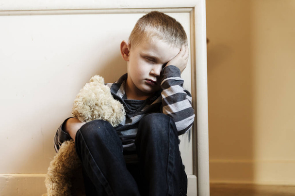 Upset problem child close to the staircase concept for bullying, depression stress - Photo, Image