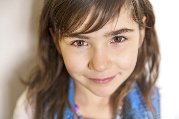 cute cheerful little girl portrait, isolated on grey background - Фото, зображення
