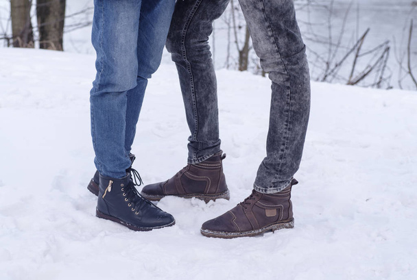 Men's and women's shoes on snow - Photo, Image