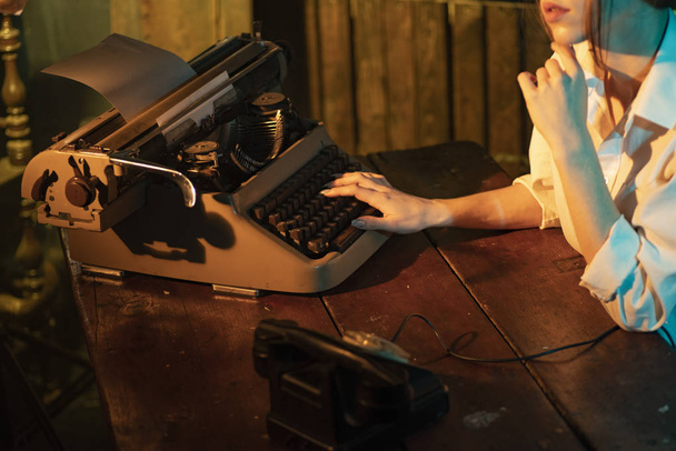 Printing on typewriter girl - Fotografie, Obrázek