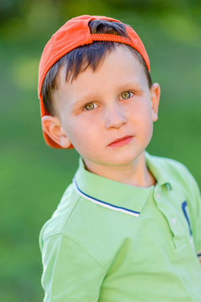 Portrait of a boy in the summer outdoors - Fotoğraf, Görsel