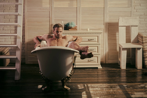 Pleasure man with sexy body bathing - Foto, Imagen